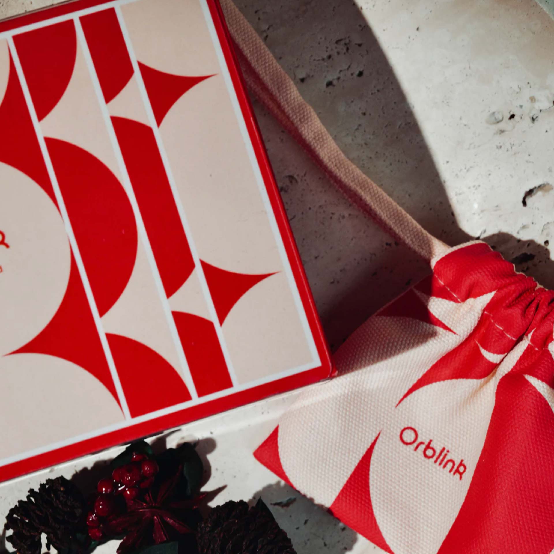 Orblink ritual packaging with a red drawstring pouch