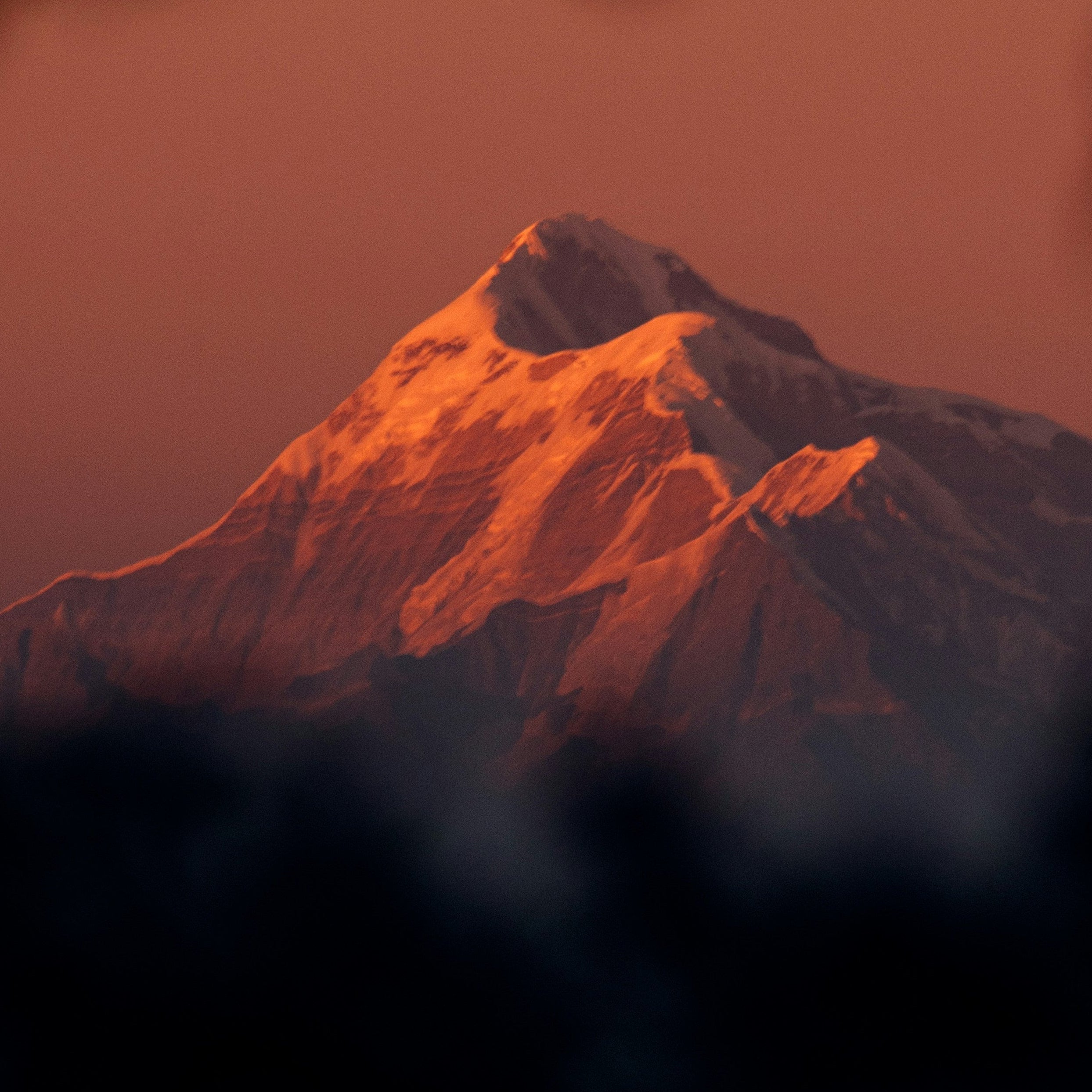 Himalayan mountain peak glowing at sunset