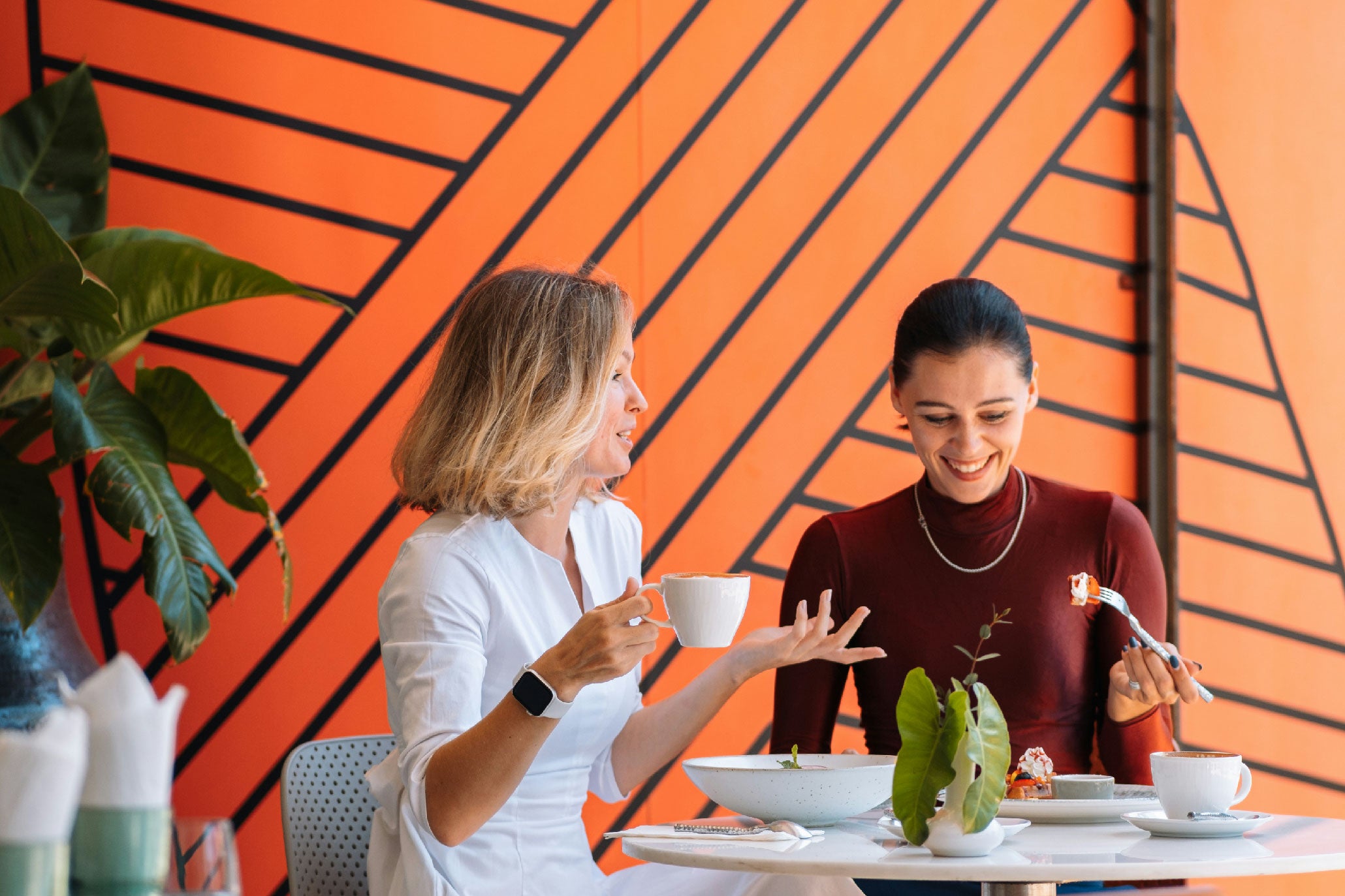 Two women preparing a crystal ritual at a table